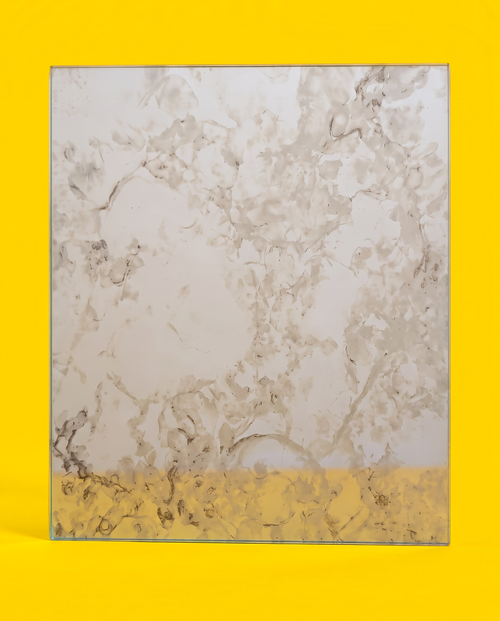 Antique mirror glass panel in the Silver Night pattern, front view, on a yellow background