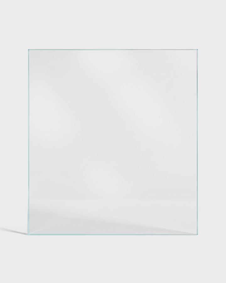 Light moving across low-iron glass on a white background